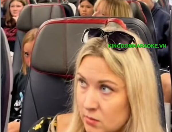 Passengers turned their head as she seemed to point to the back of the plane while speaking about a guy who 'was not real'