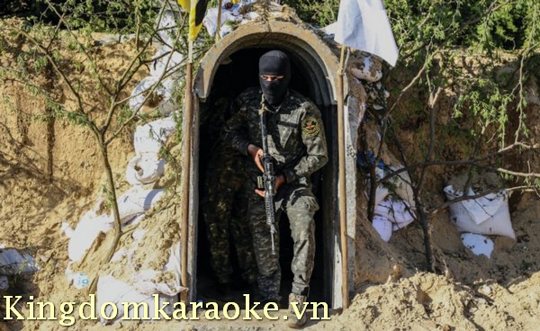 A terrorist from the al-Quds Brigades, the military wing of the Palestinian Islamic Jihad, is seen inside a military tunnel in Beit Hanun, in the Gaza Strip