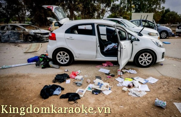 Personal belongings near cars abandoned following the party in Kibbutz Re'im
